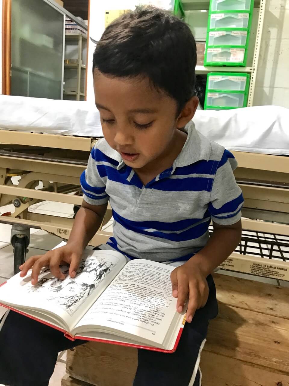 Boy reading during the Guatemela volunteer program